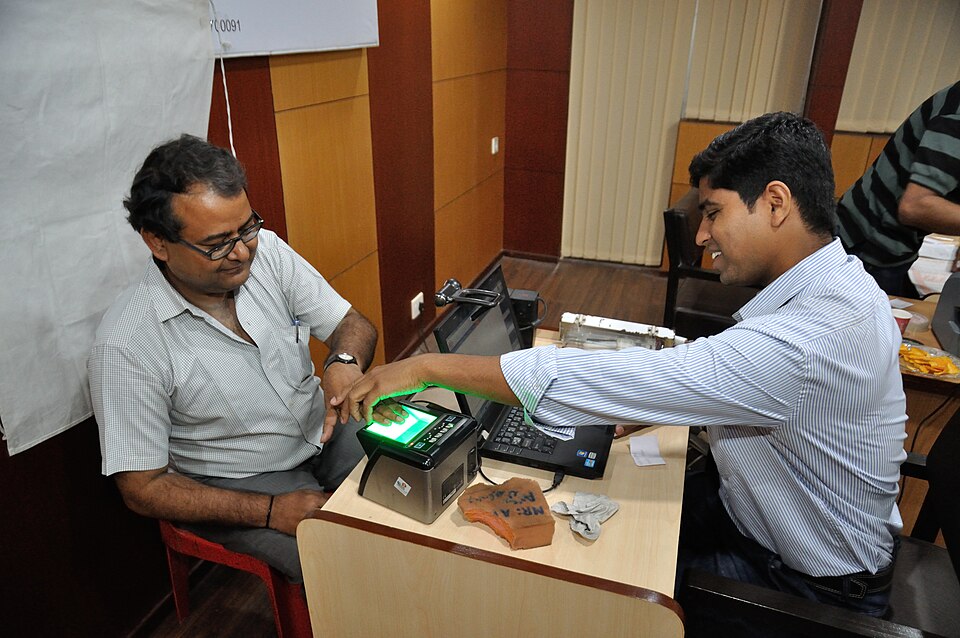 Fingerprint scanning at an Aadhaar biometric registration camp in Kolkata, India.