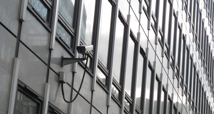 A CCTV camera mounted on the exterior of a building in London.