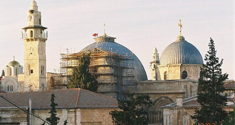 Domes of the Church of the Holy Sepulchre above the rooftops of Jerusalem’s Old City.