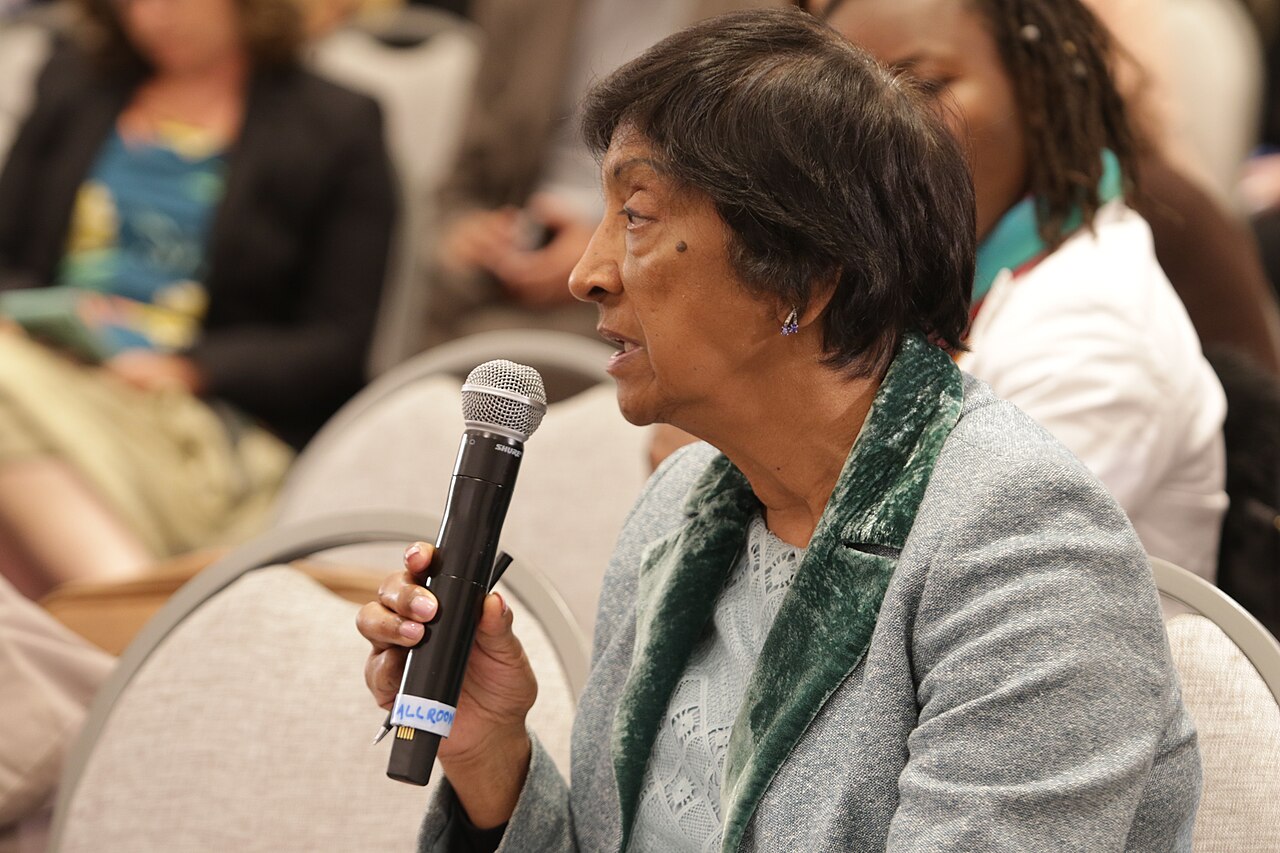 Navi Pillay holding a microphone at an event in August 2018.
