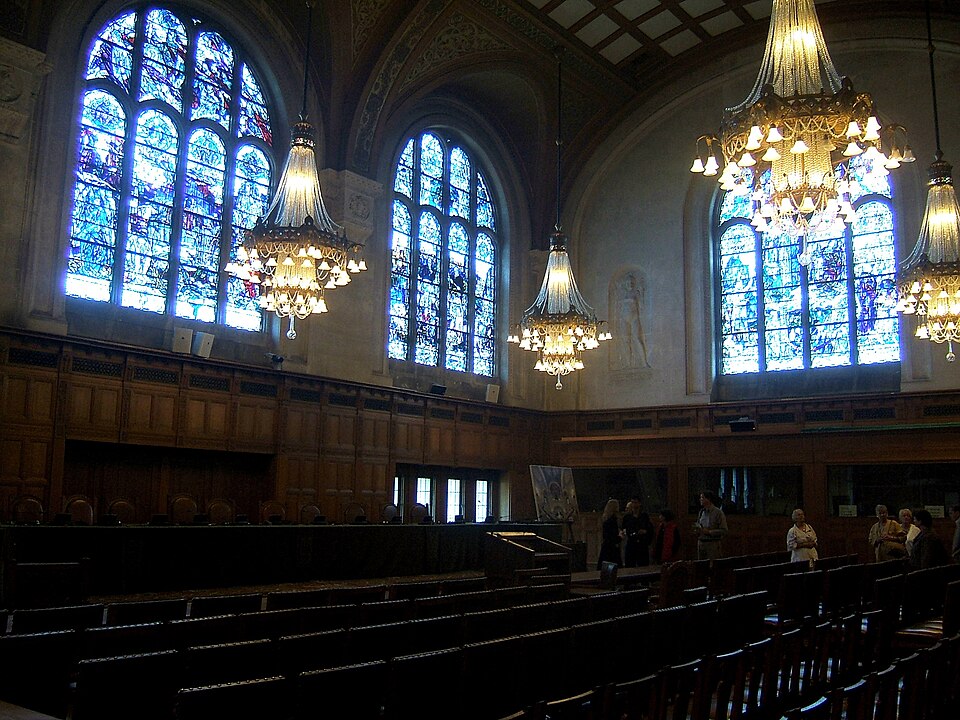 The courtroom inside the Peace Palace, with stained-glass windows and visitor seating, during an open day in September 2006.