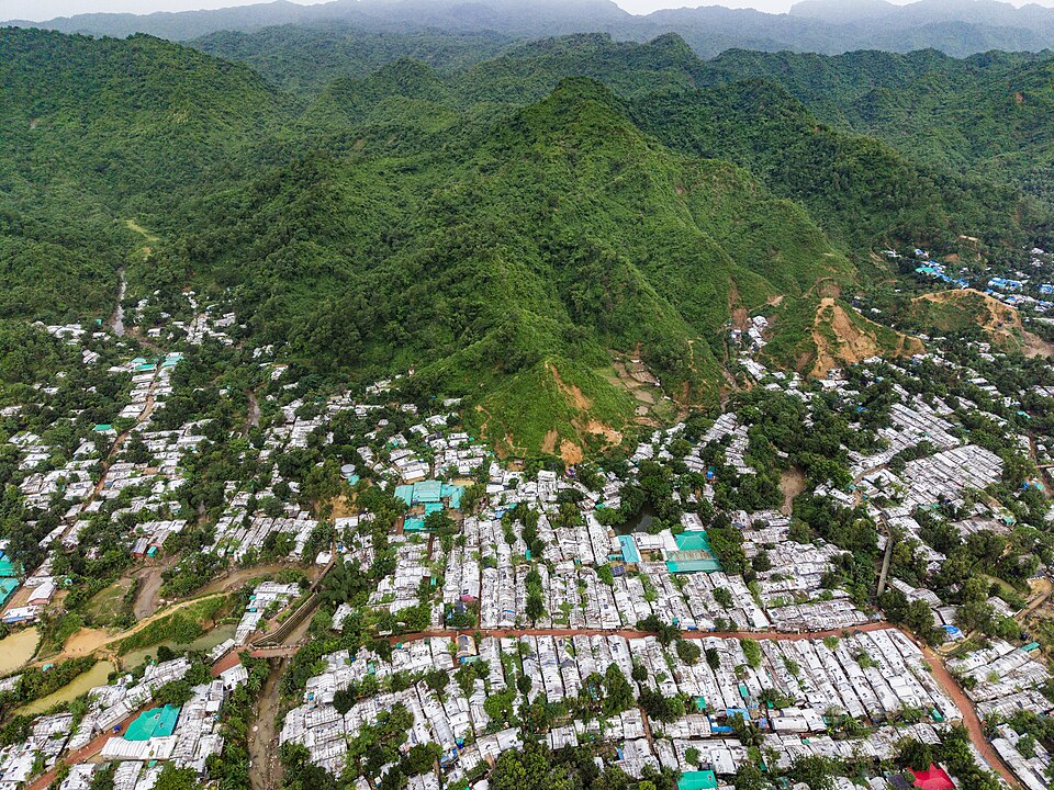 An aerial view of Rohingya refugee shelters among hills in Cox’s Bazar, Bangladesh, in July 2026.